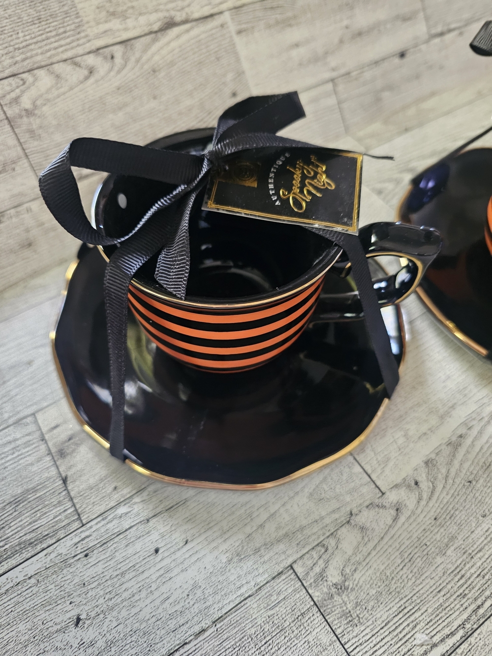 Potter's Studio Black and Orange Striped Teacup and Saucer Set